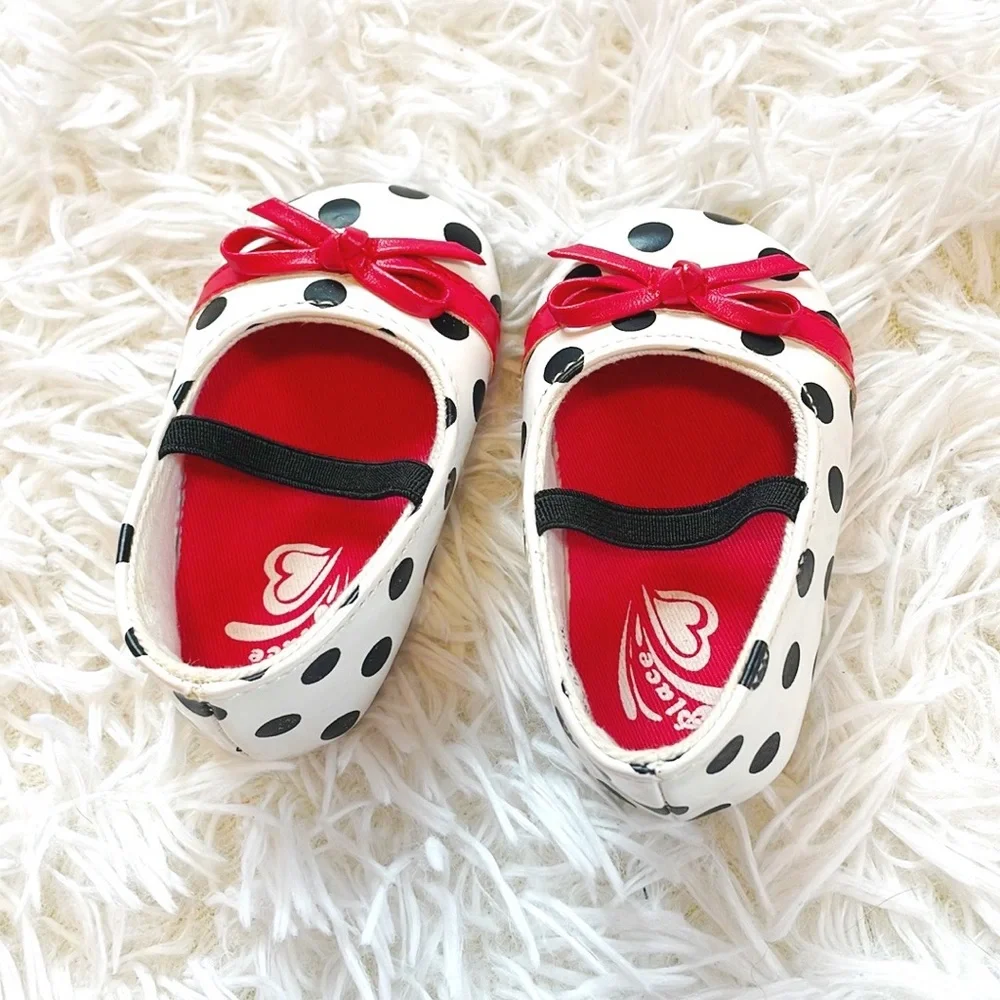 Place • Black and White Baby Polka Dot Mary Janes with Red Bow Accent Detailing